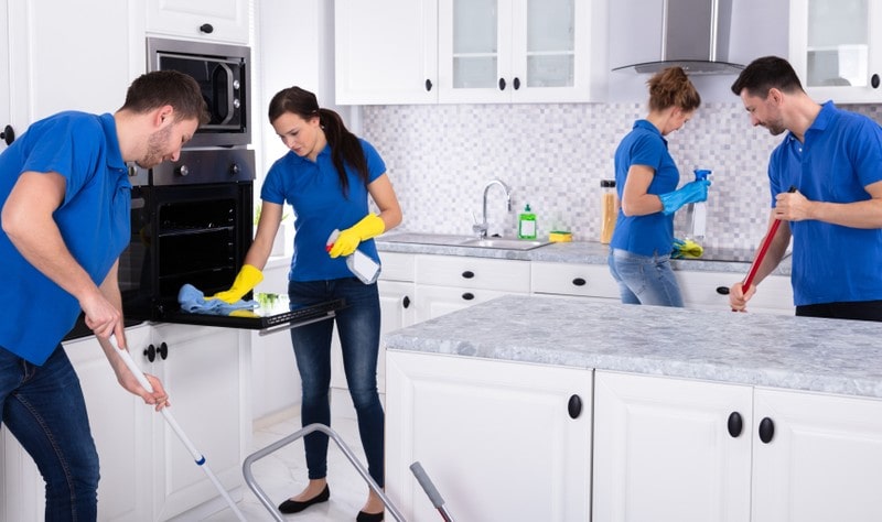 professional team sprucing up a kitchen