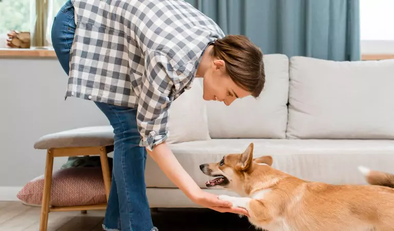 woman with her pet inside of her house