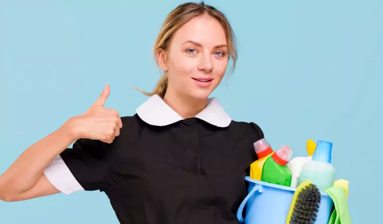 woman with cleaning supplies ready to clean her house