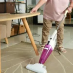 Woman steam mop cleaning floor