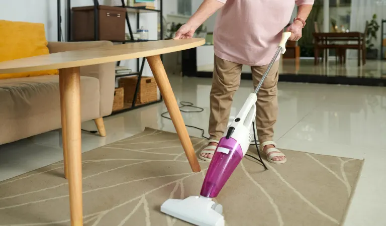 Woman steam mop cleaning floor
