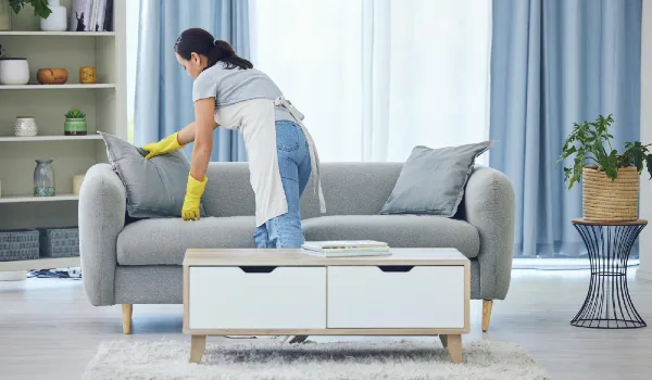 It looks good now shot of a young woman cleaning at home